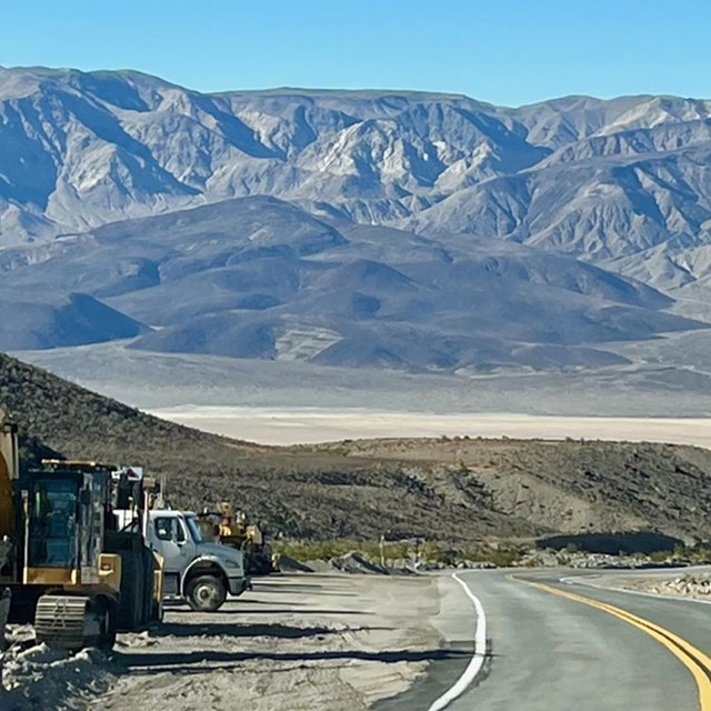 View of Towne Pass section of CA-190 overlooking Panamint Valley. Contruction vehicles stationed.