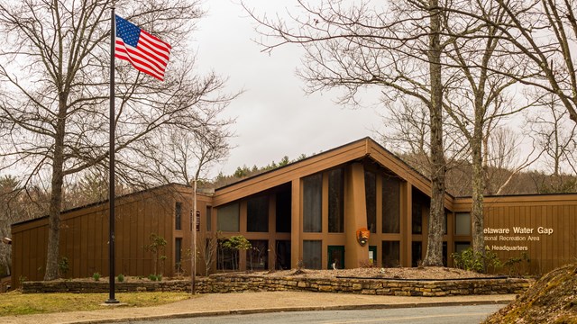 Park headquarters, a brown building, with leafless trees in the background.