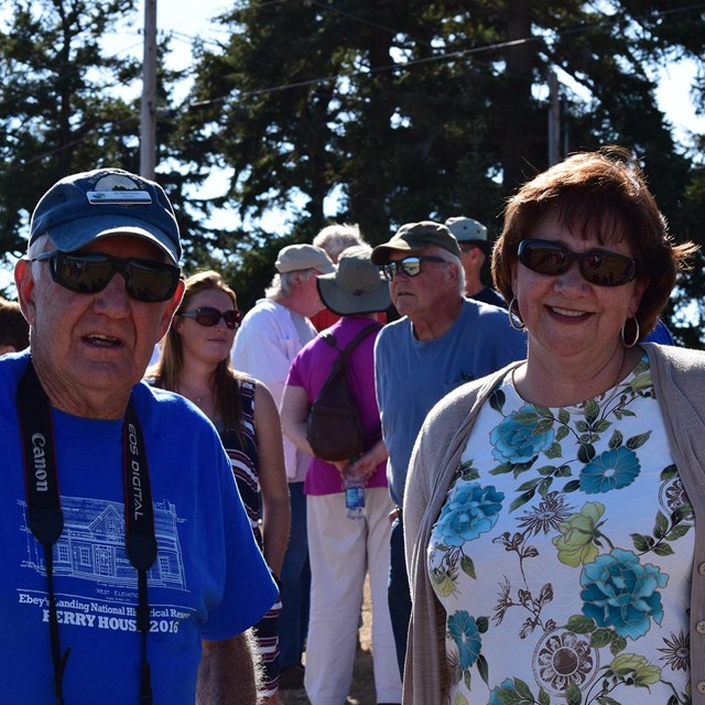 Al Sherman and Mayor Molly pose for a photo outside.