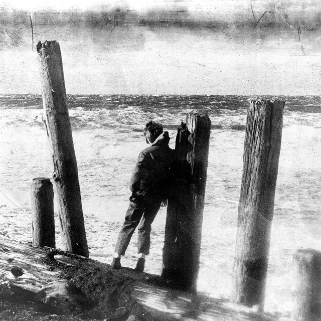 historic photo of child looking at the ocean.