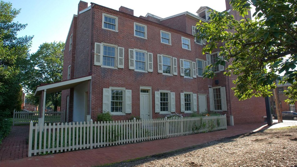Exterior photo of the Edgar Allan Poe National Historic Site, a three-story brick building.