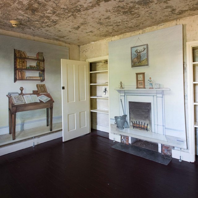 Color photo showing an empty room with murals of furniture on the walls.