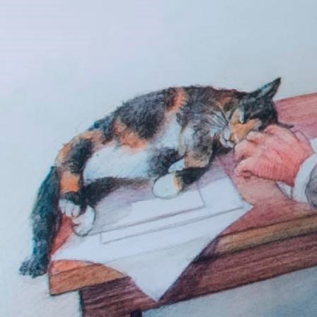 Color photo of an illustration of a man writing at a desk with a cat nearby.