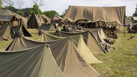A row of green army tents