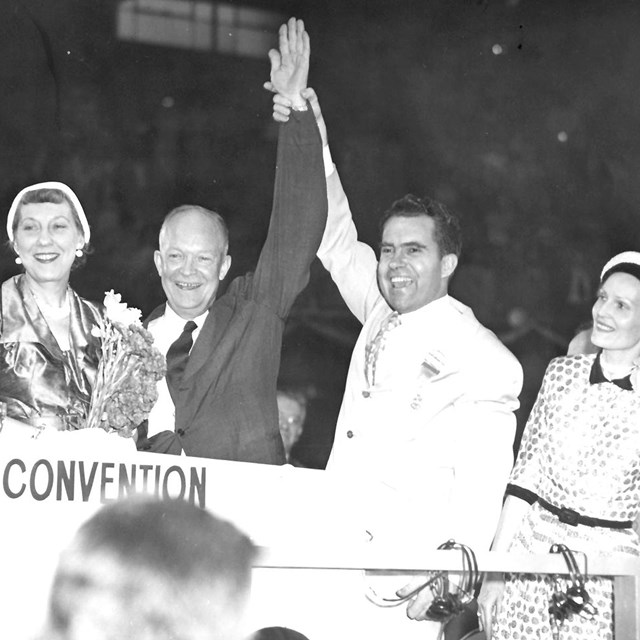Black and white image of Eisenhower and Nixon on stage