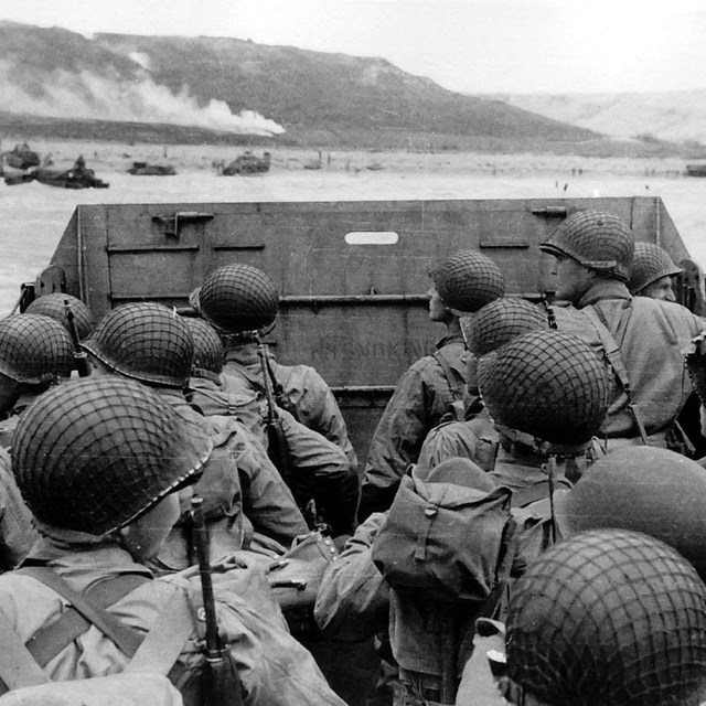 Black and white image of soldiers on a landing craft