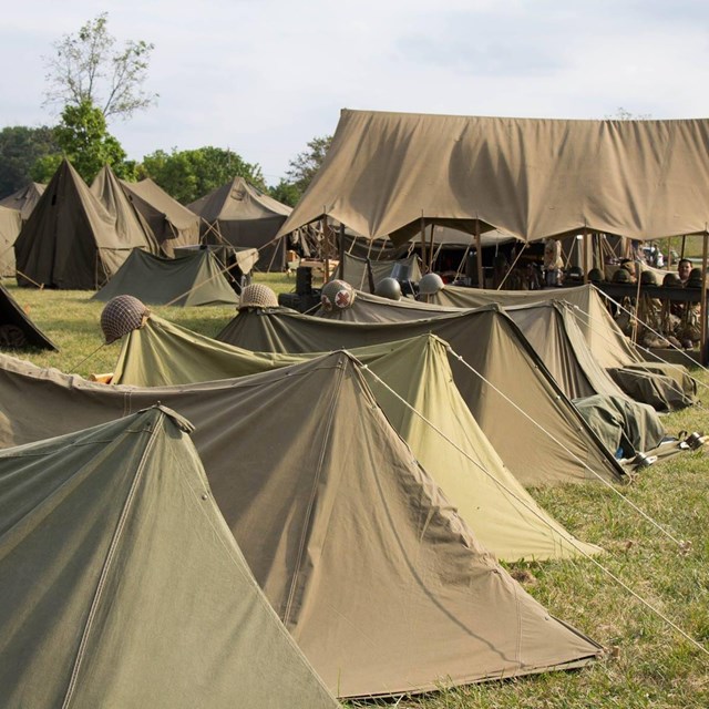 A row of green army tents