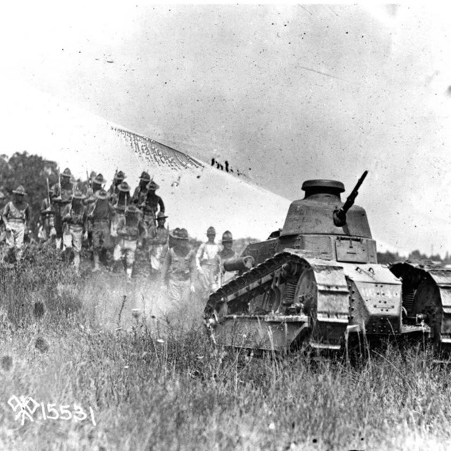 A WWI era tank drives through the Gettysburg battlefield