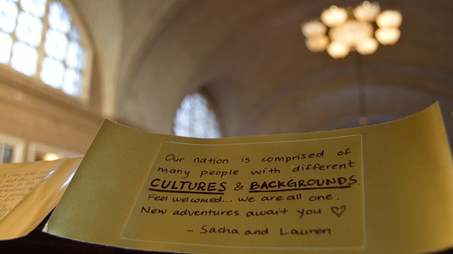  Paper gold brick with message to new arriving immigrants.