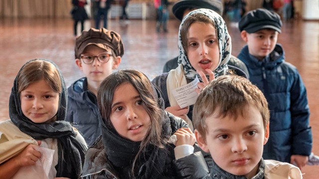 Students dressed as newly arriving immigrants from the early 20th Century.