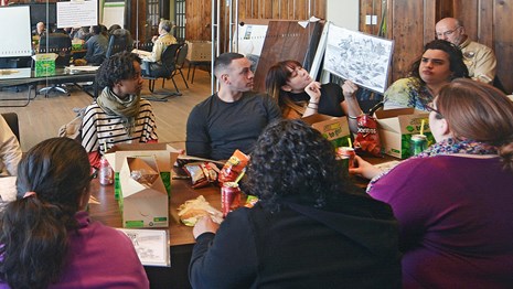 Students dressed as workers arriving to the entrance of the main immigration building.