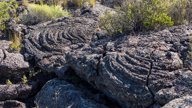 dark black rock in ropy pattern