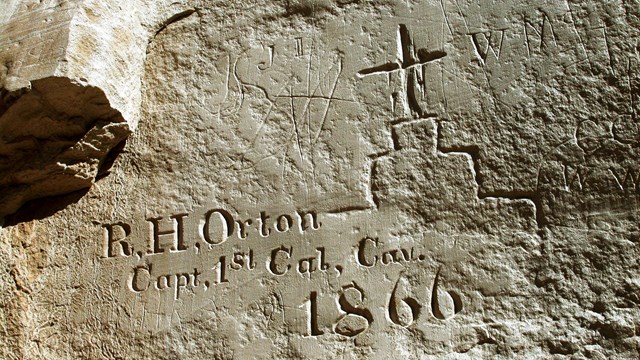 An English inscription on a rock next to a drawing of a church.