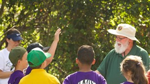 A Volunteer-in-Park Leading a Program