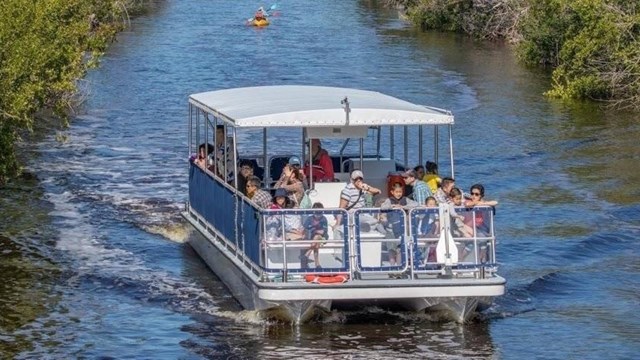 People on a boat in a canal.