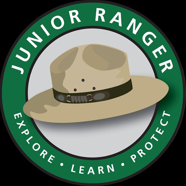 A park ranger hat in a circle that reads, 