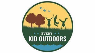 logo of kids playing outside with text Every Kid Outdoors