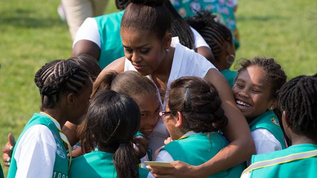 Michelle Obama hugs Girl Scouts