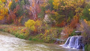 Niobrara River lined with trees with changing leaf colors