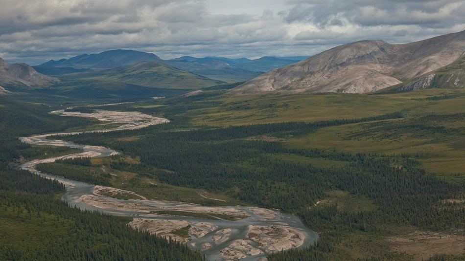 River winding through a valley lined with mountains