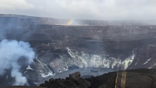 Fumes rising from an active volcano crater