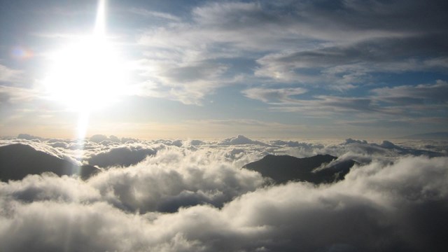 Crater sticking up above the clouds