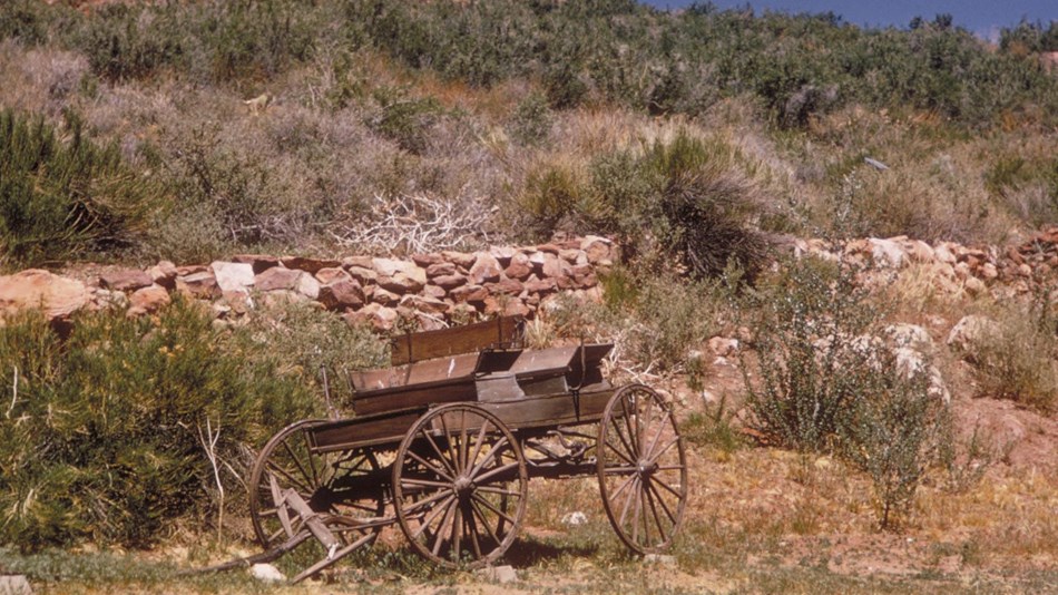 Wagon at the base of a desert hill