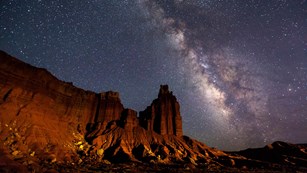 Milky Way over a red-rock cliff face