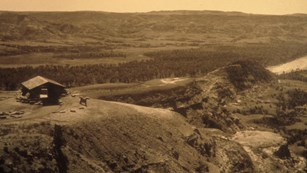 Historic photo of an early park building overlooking a valley