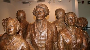 Statues of women's rights activists, including Frederick Douglass