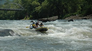 people on raft, water rafting on rapids 