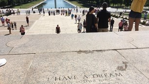 Text engraved on an outdoor set of stairs marking where Dr. Martin Luther King stood