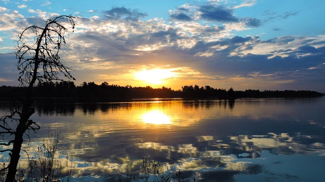 sunrise with a lake and marsh