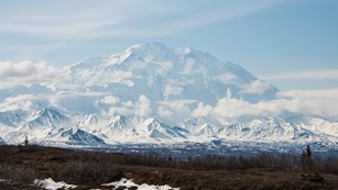Very tall mountain towering over a mountain range