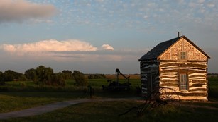 Historic small cabin on a prairie