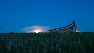 Visitor center in a prairie at night