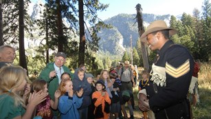 Ranger dressed as a buffalo soldier giving a program to kids