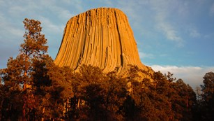 Devils Tower rock formation at sunset