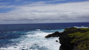 waves clashing onto rocks