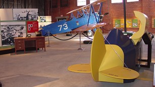 WWII-era planes inside a hangar