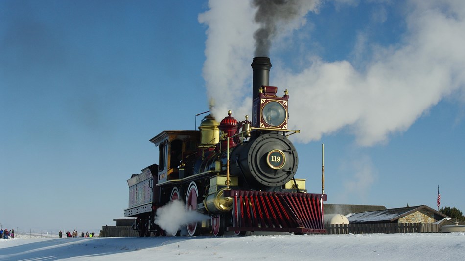 Steam engine train on a railroad track