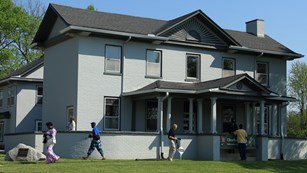 Visitors walking in front of Charles Young's house