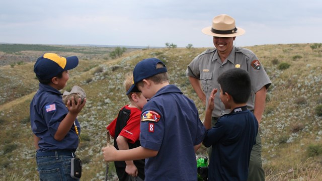 A ranger leads a group of boyscouts