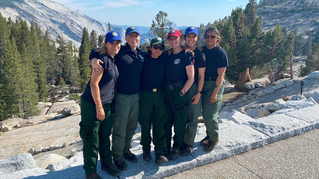 A group of fire staff on an overlook at Yosemite National Park.