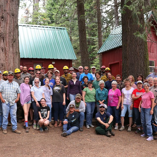 Firefighters and Ccmmunity embers pose for a picture after a community clean-up day.