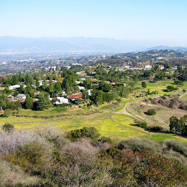 A community in central California is built along the edge of a national park. 