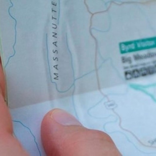 close up of person holding map. 
