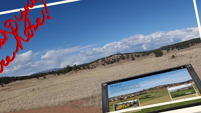 Photograph of a grassy valley with a wayside panel at front.