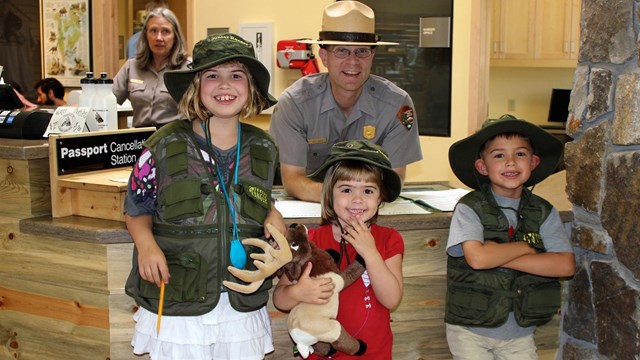 Junior Rangers at the desk in the Visitor Center