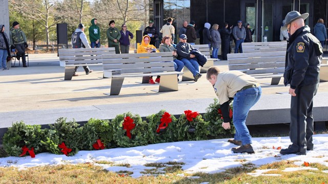 Visitors participate in laying wreaths during a special use permit. 